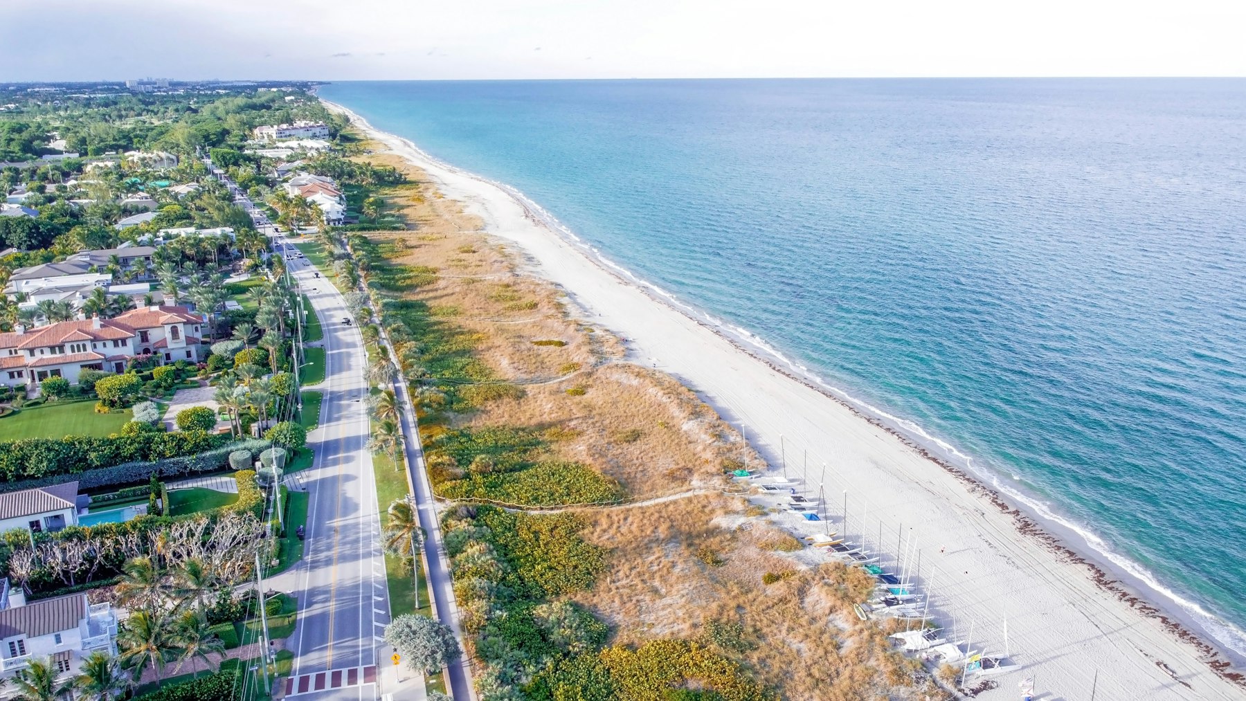 Aerial view of a Florida barrier island road and beach