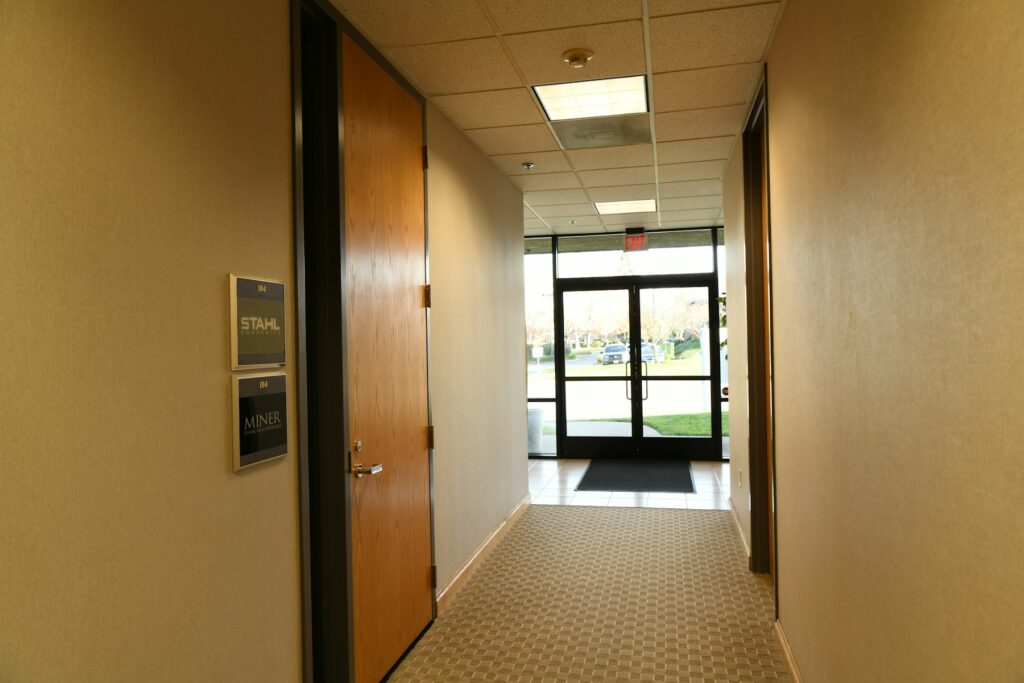 Office corridor with locked suite doors
