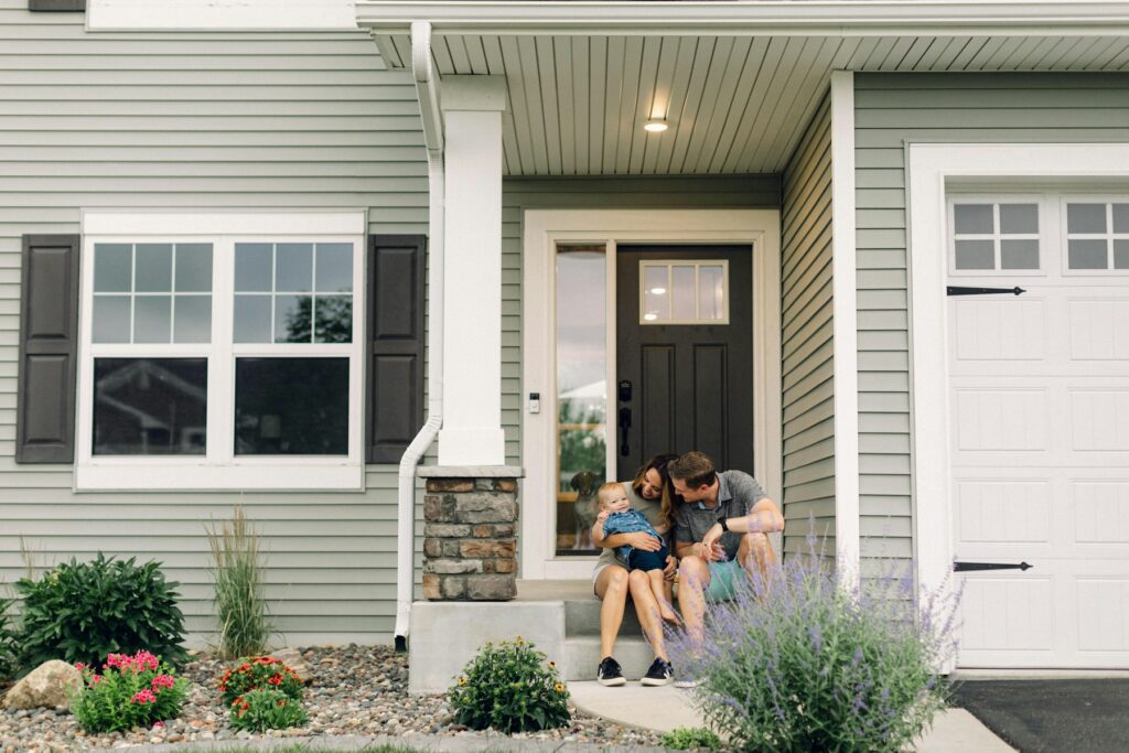 Family on the front steps of their home