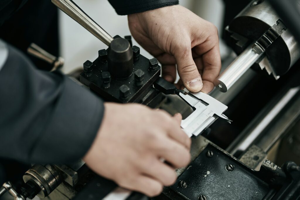 Locksmith cutting a key on a key machine