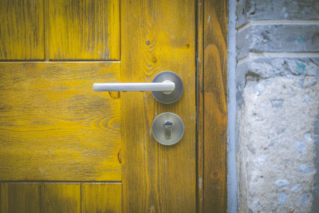 Lever handle and lock cylinder on a wood door