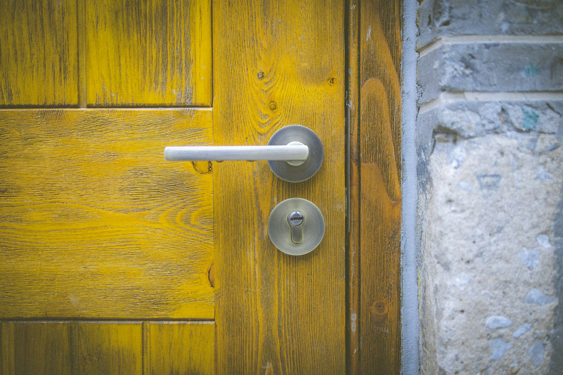 Lever handle and lock cylinder on a wood door