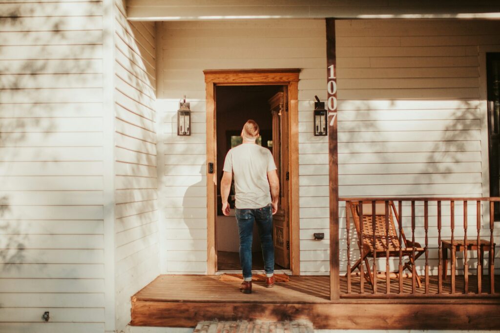 Man walking into his home