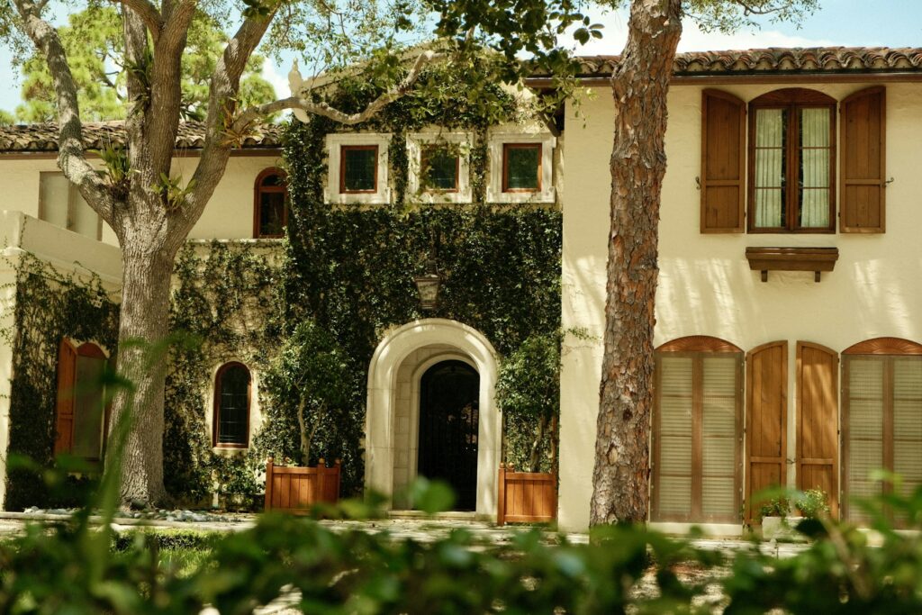 Mediterranean style home with an arched entry
