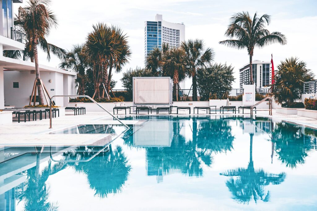 Condo pool with palm trees