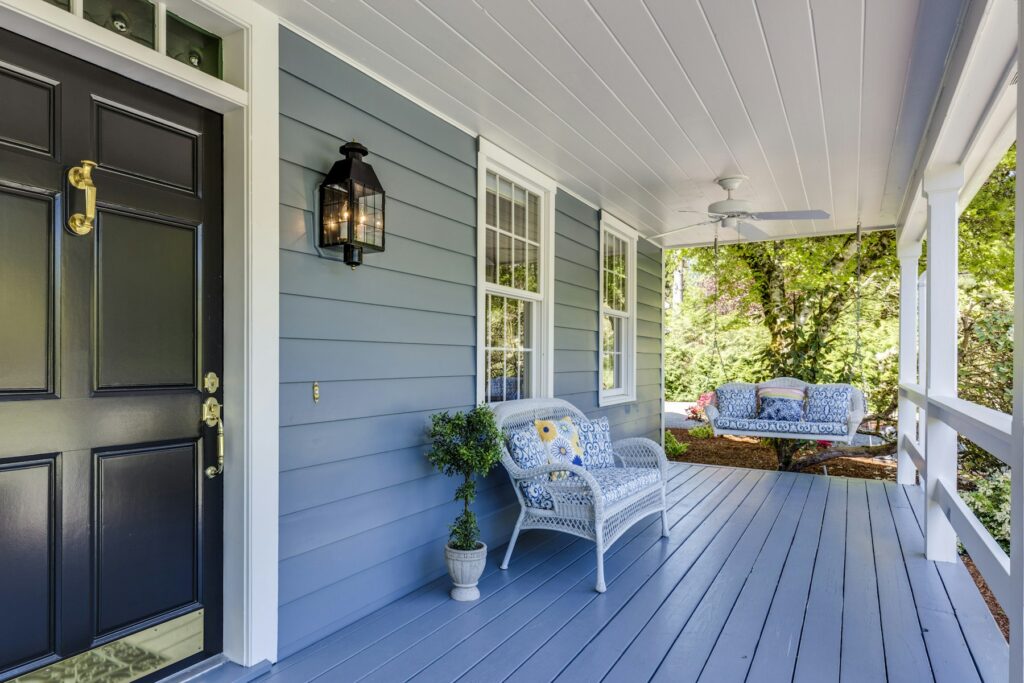 Front porch and black front door of a Florida home