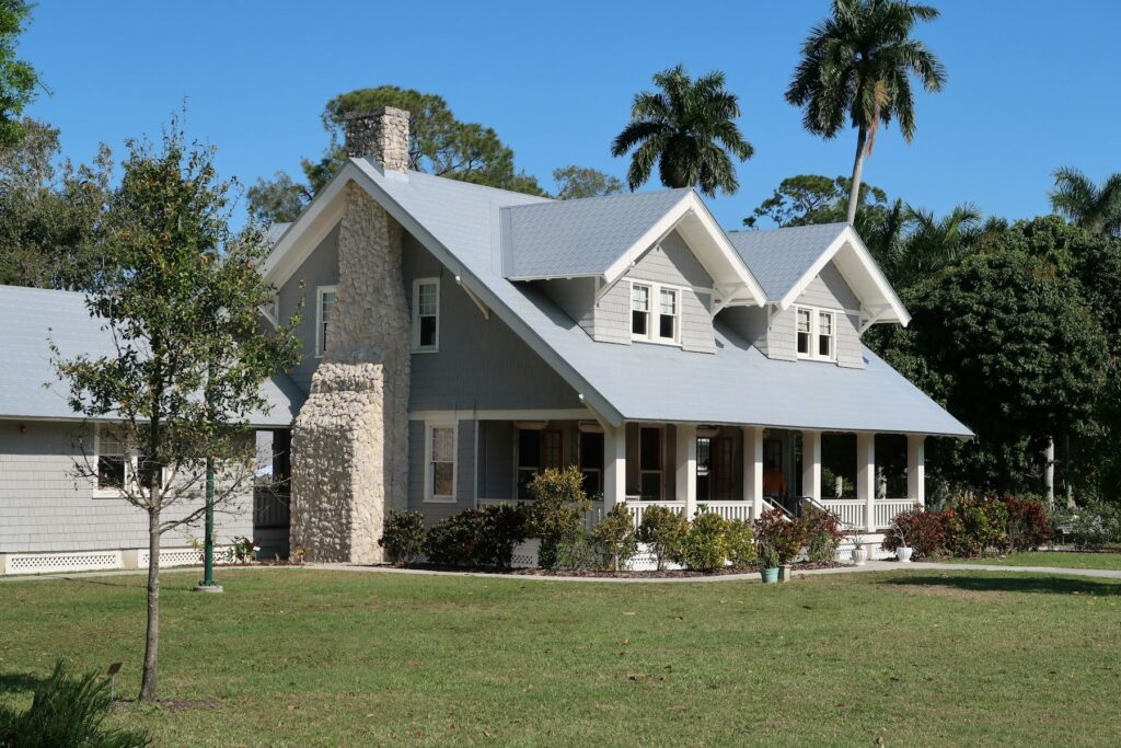 Florida home with a wraparound porch and palms
