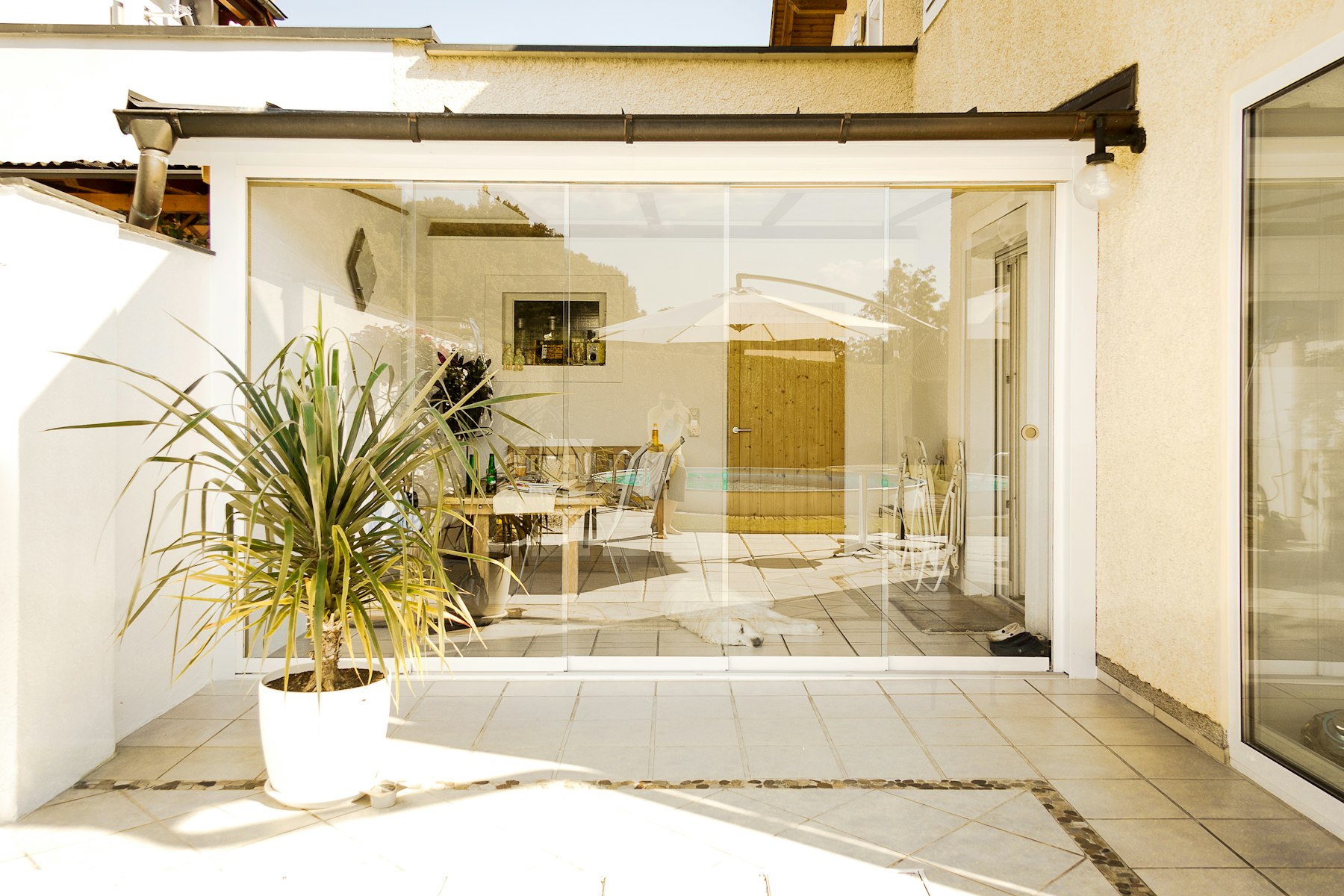 Open sliding glass wall to a patio